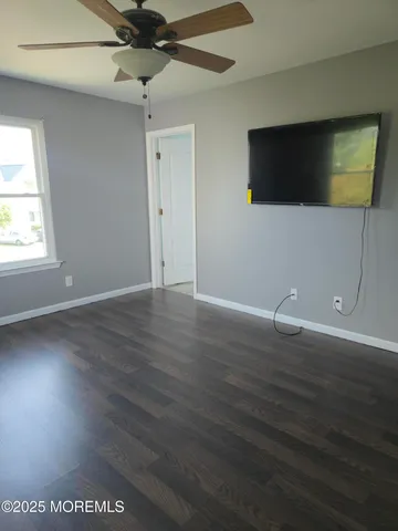 a white toilet sitting next to a sink