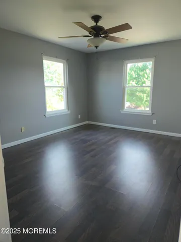 a bed room with a bed and a window