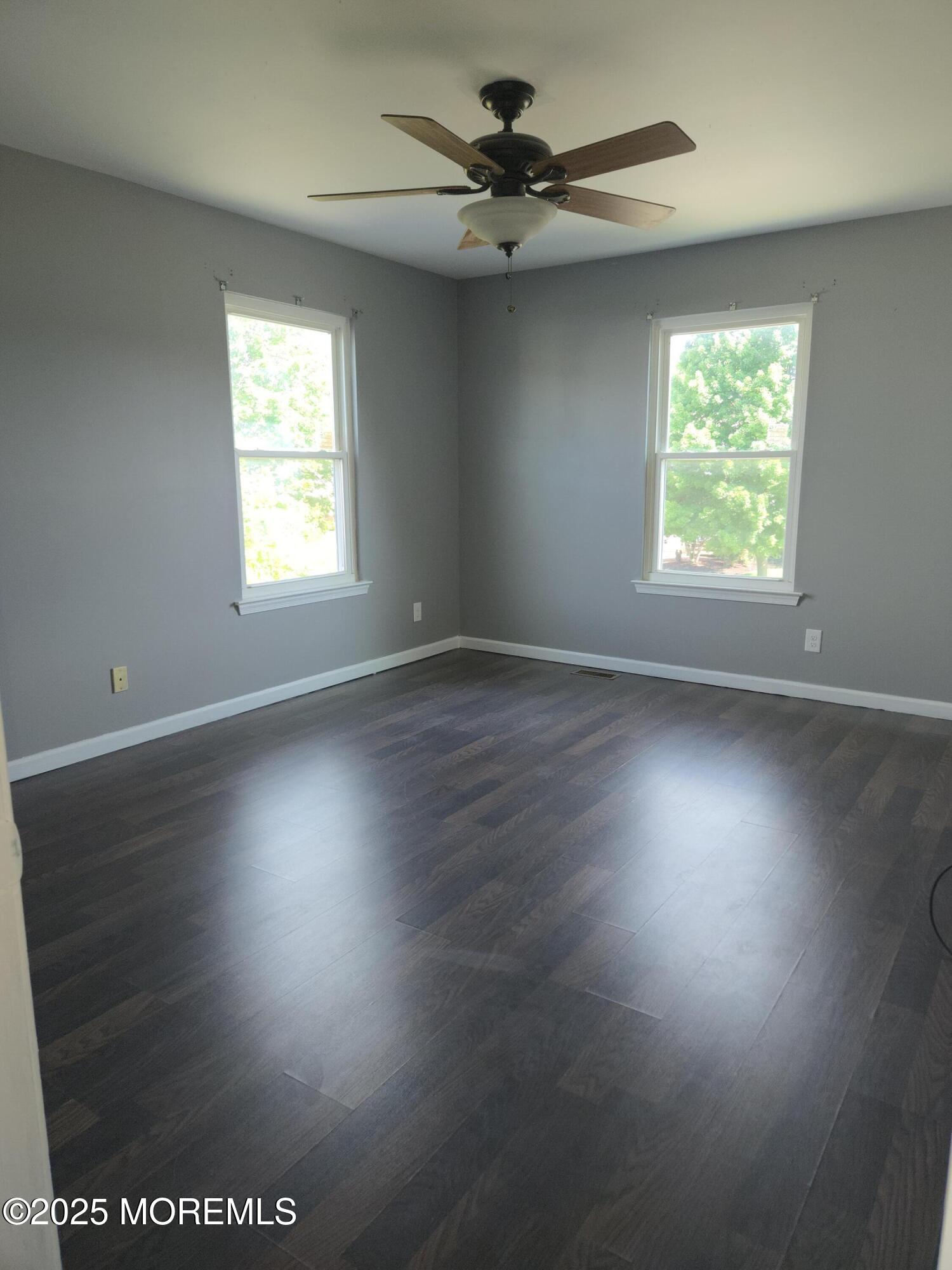 34 Vance Avenue Sicklerville, NJ 08081 - Photo 26 of 30 an empty room with wooden floor and windows