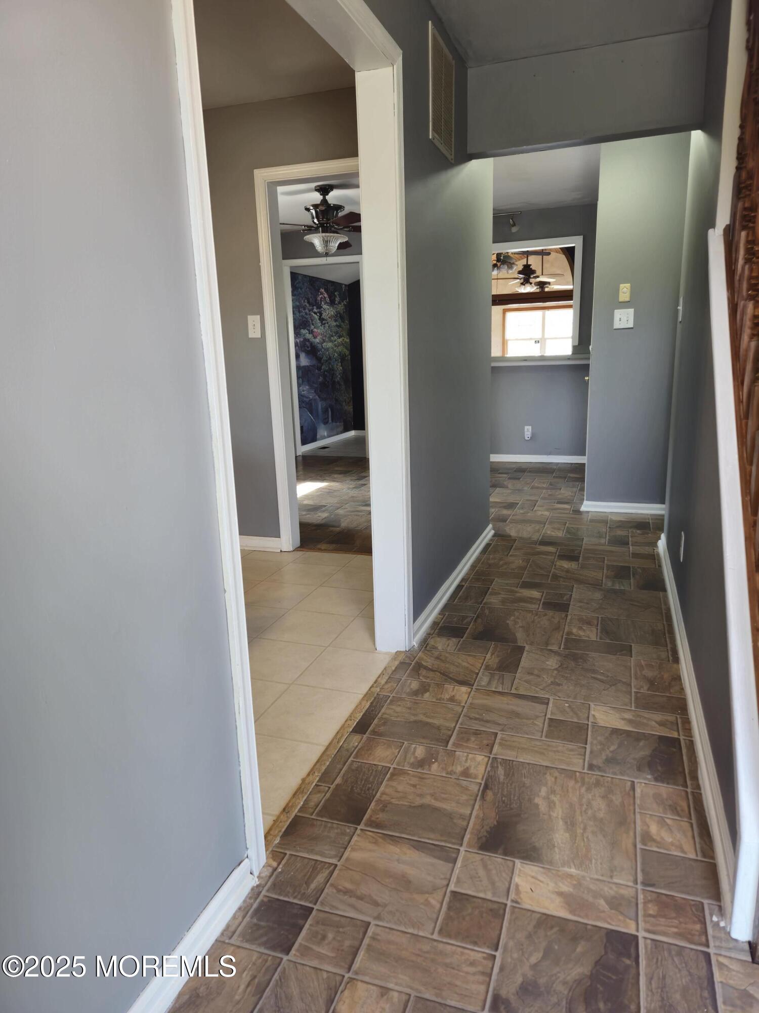 34 Vance Avenue Sicklerville, NJ 08081 - Photo 8 of 30 a view of livingroom with hallway and stairs
