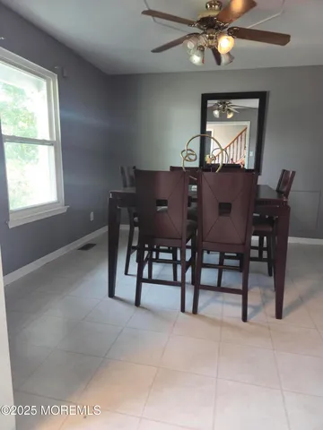 a kitchen with granite countertop a refrigerator and a sink