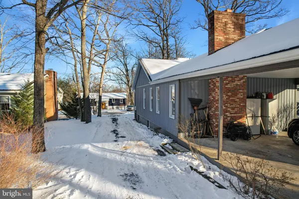 a view of a snow on the yard