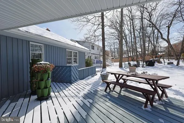 a view of a chairs and table on the wooden deck