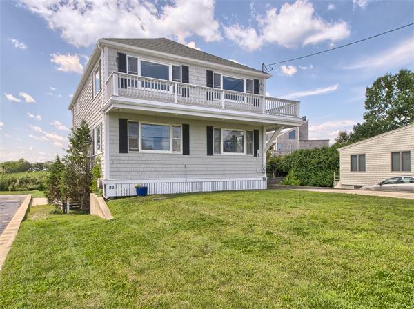 32 Surfside Road Scituate, MA 02066 - Photo 1 of 18 a front view of a house with a garden