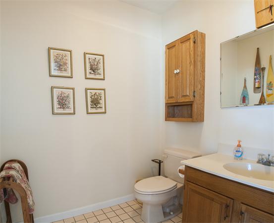 32 Surfside Road Scituate, MA 02066 - Photo 11 of 18 a bathroom with a toilet sink and mirror