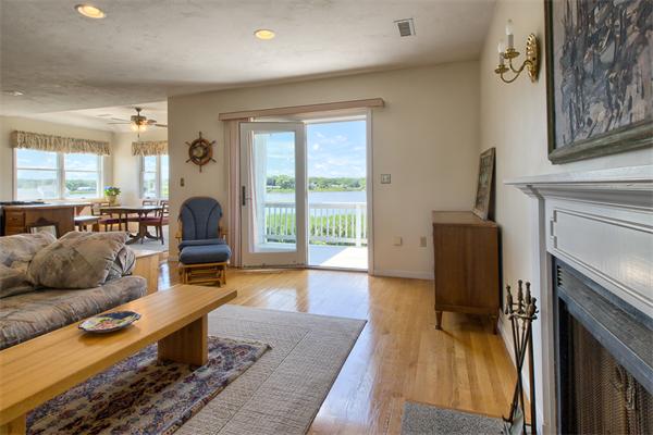 32 Surfside Road Scituate, MA 02066 - Photo 4 of 18 a living room with furniture and a fireplace