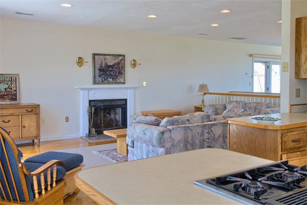 32 Surfside Road Scituate, MA 02066 - Photo 5 of 18 a bed room with furniture and a fireplace