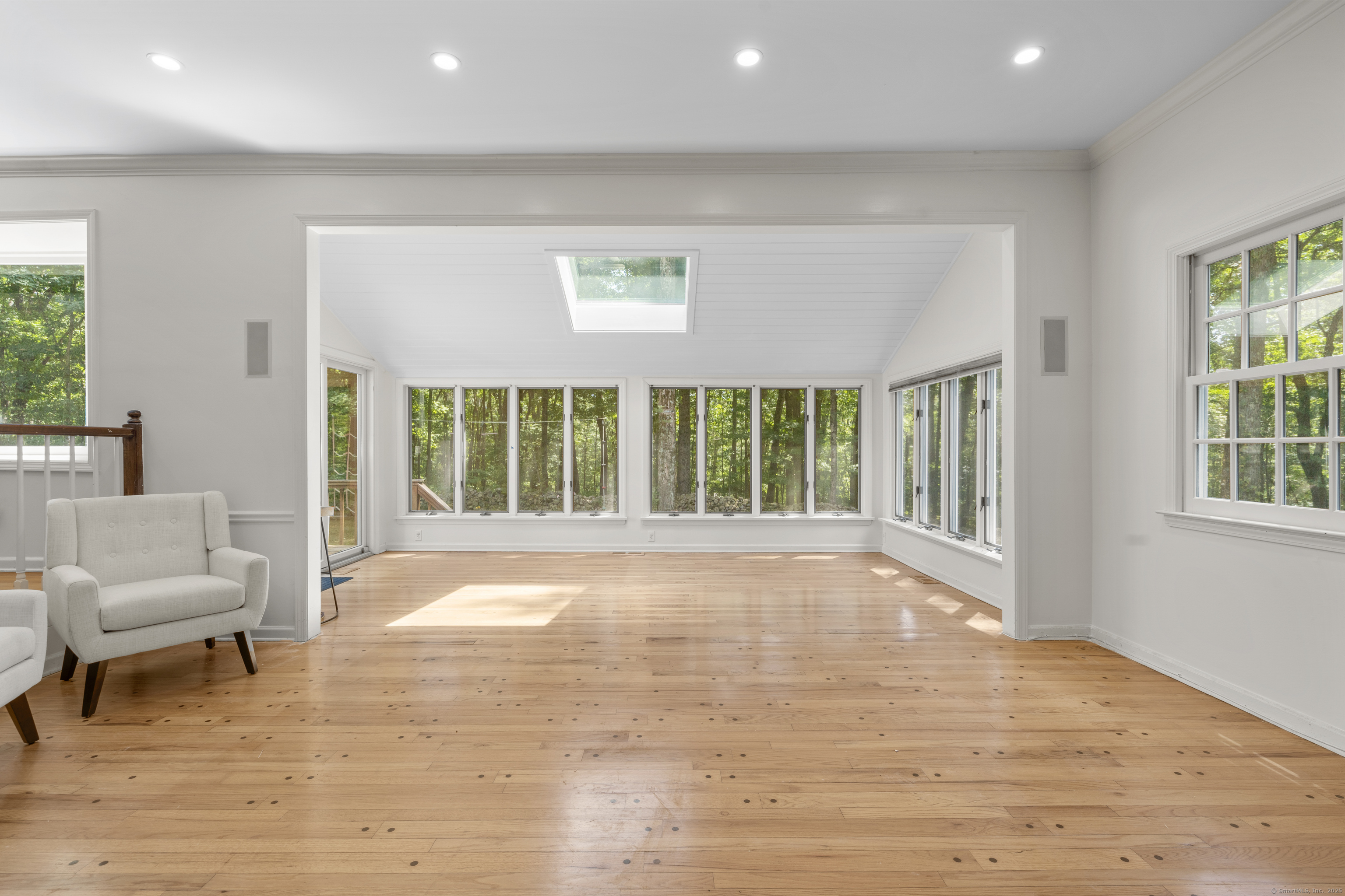 181 Old Boston Road Wilton, CT 06897 - Photo 11 of 30 a view of an empty room with a window and wooden floor