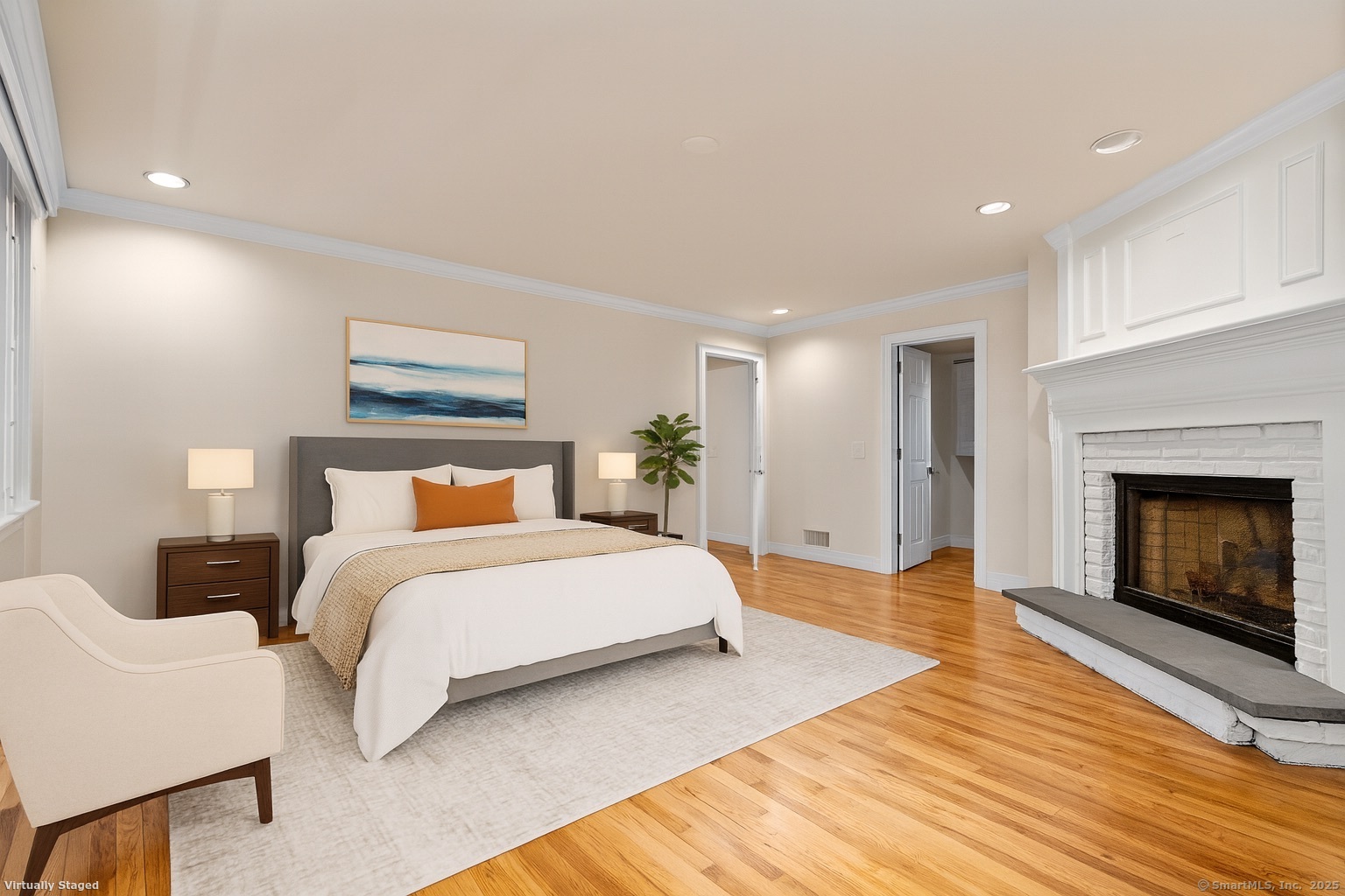 181 Old Boston Road Wilton, CT 06897 - Photo 14 of 30 a spacious bedroom with a bed and a fireplace