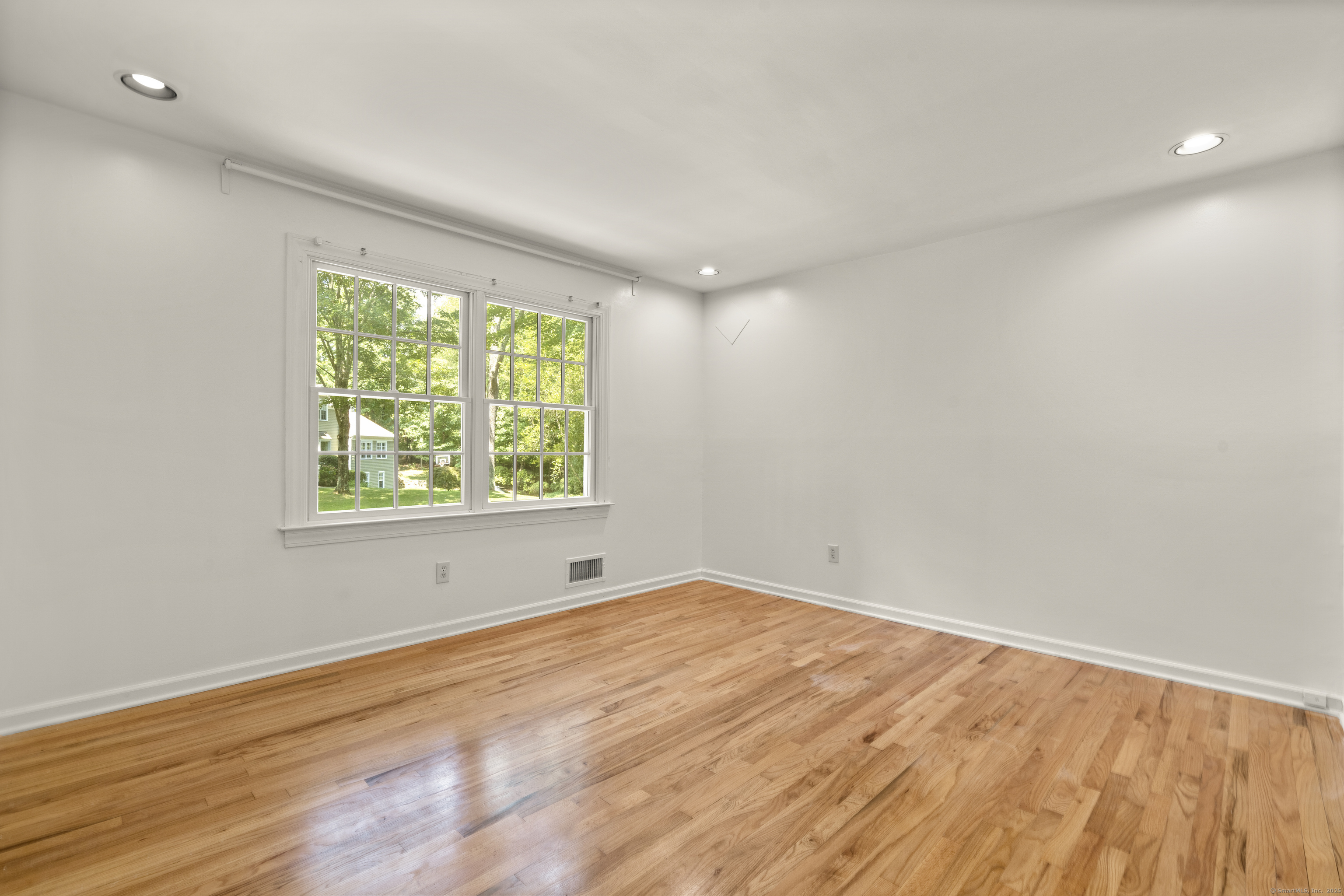 181 Old Boston Road Wilton, CT 06897 - Photo 19 of 30 wooden floor in an empty room with a window
