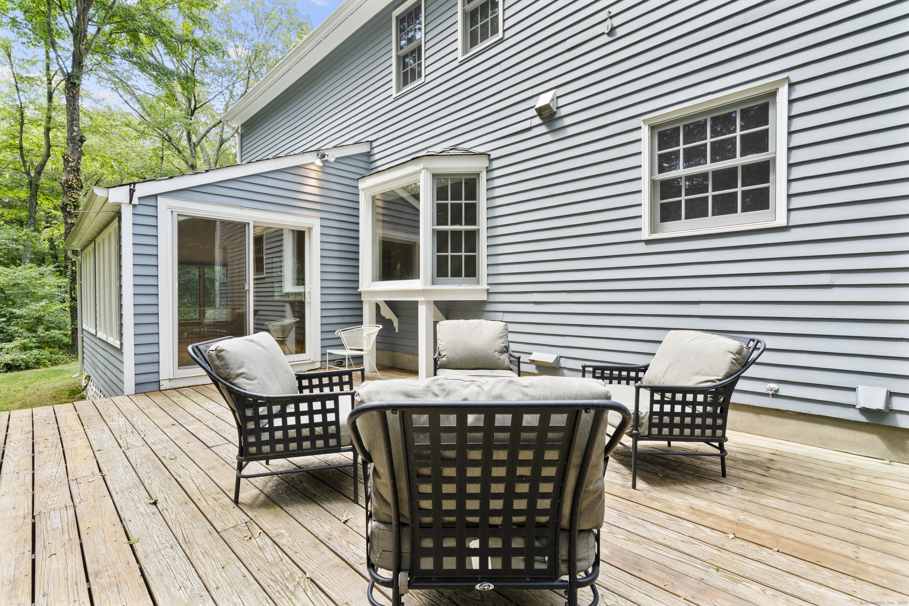 181 Old Boston Road Wilton, CT 06897 - Photo 24 of 30 a view of a roof deck with table and chairs