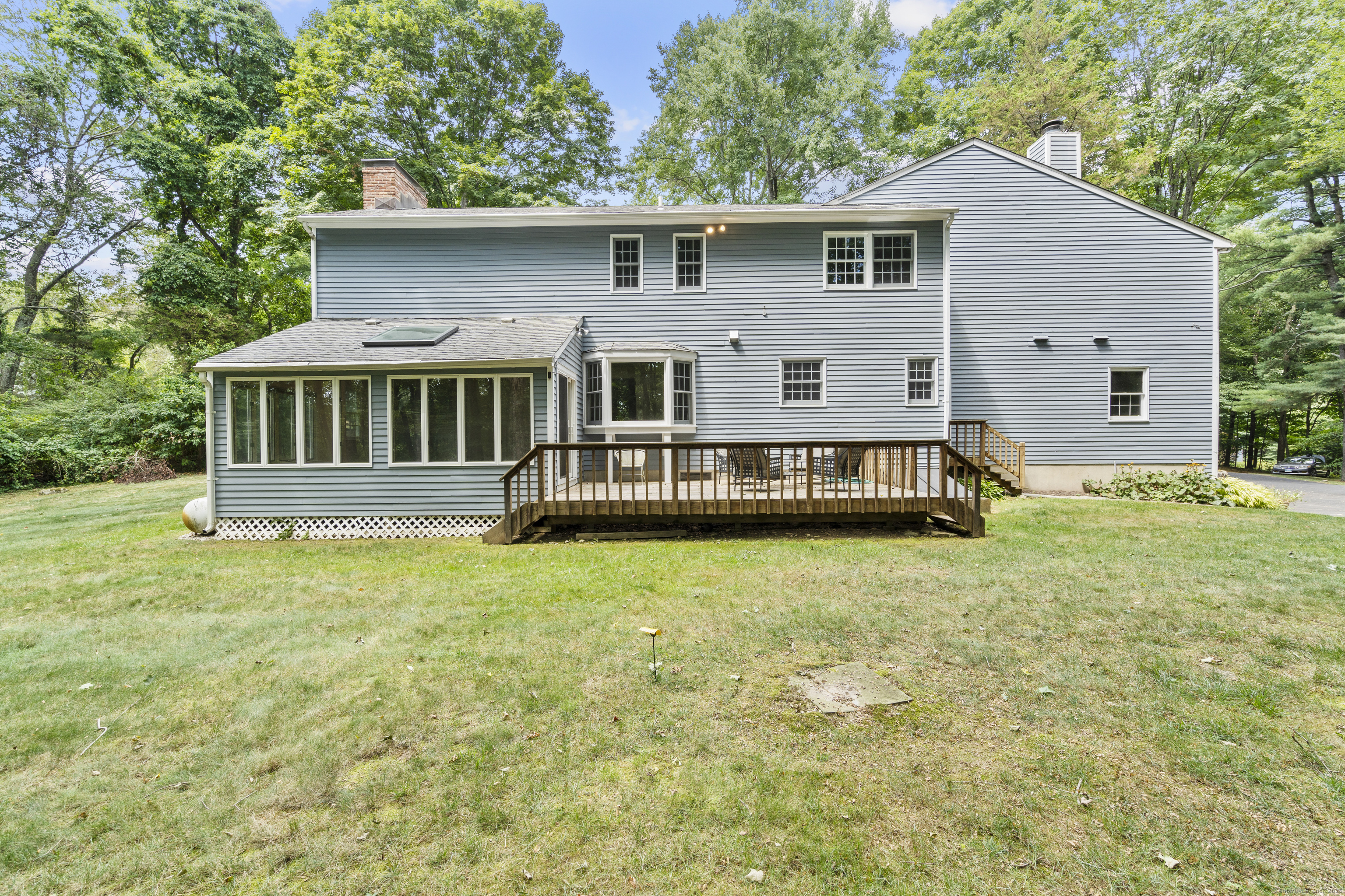 181 Old Boston Road Wilton, CT 06897 - Photo 27 of 30 a front view of a house with yard and green space