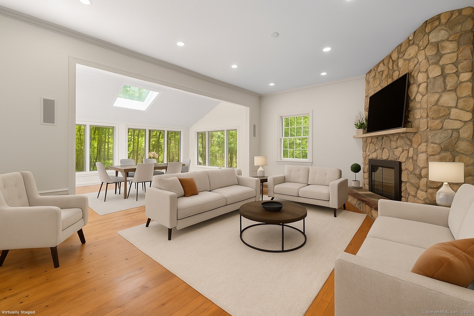 181 Old Boston Road Wilton, CT 06897 - Photo 10 of 30 a living room with furniture flat screen tv and a fireplace