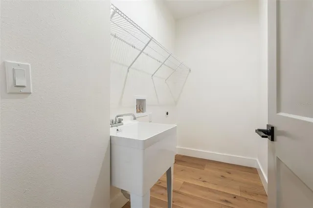 a bathroom with a sink toilet and vanity