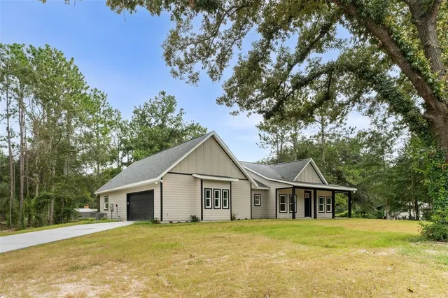 front view of a house with a yard