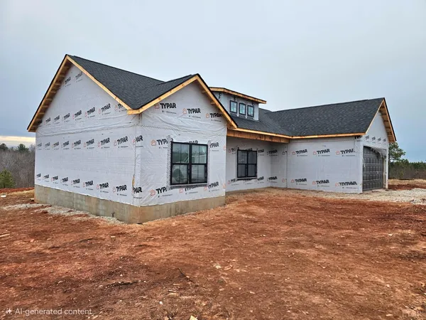 a view of a house with wooden fence