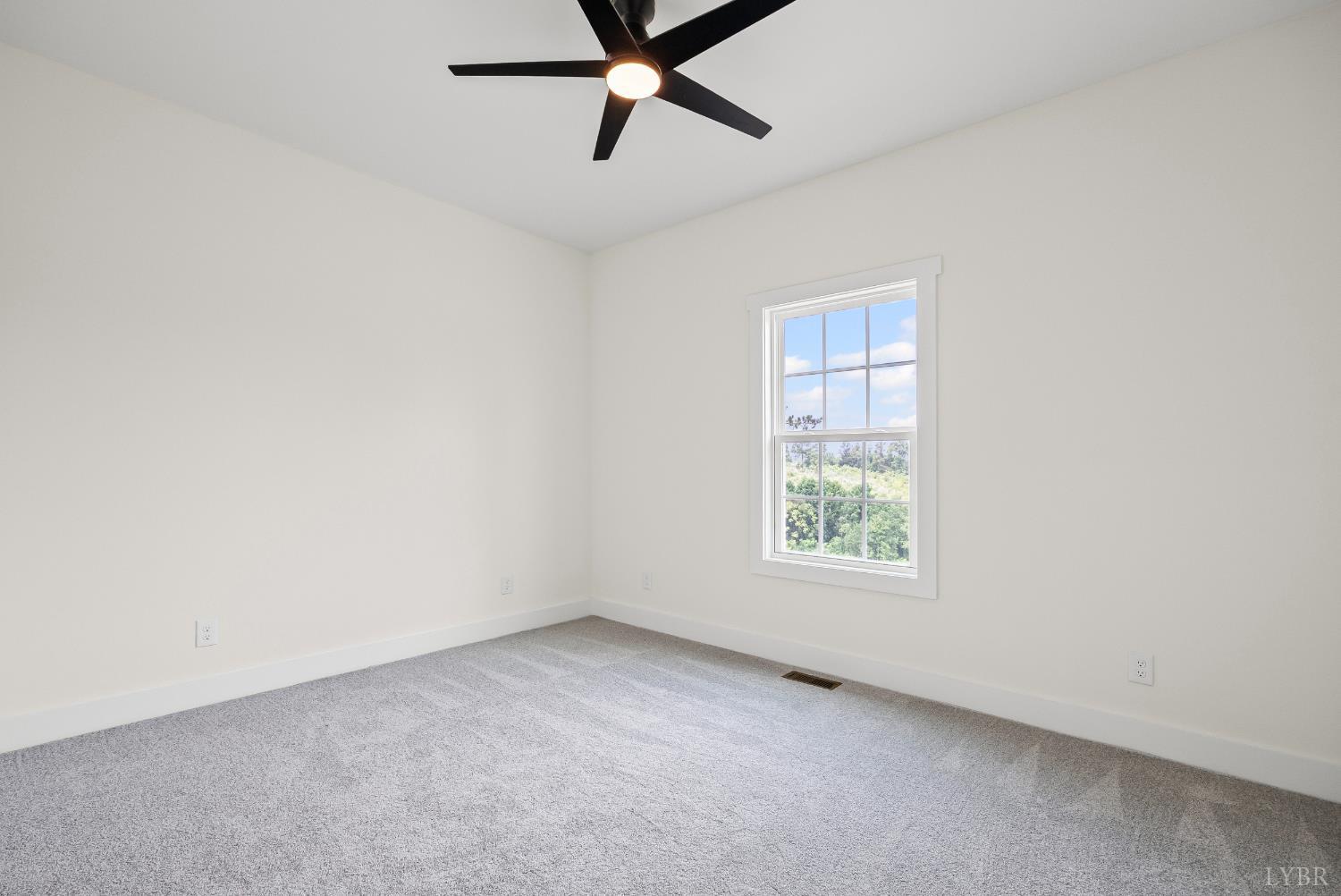 187 Fox Hall Drive Amherst, VA 24521 - Photo 31 of 36 an empty room with a window and a fan