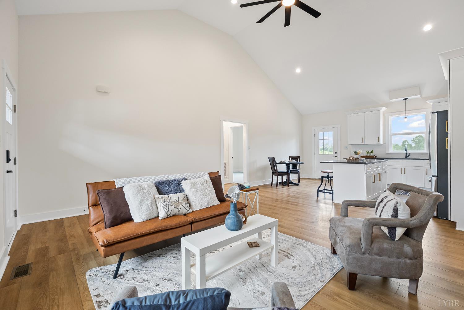 187 Fox Hall Drive Amherst, VA 24521 - Photo 6 of 36 a living room with furniture and a view of kitchen