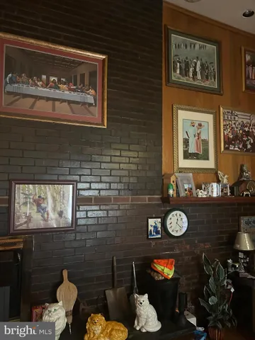 a bench sitting in a kitchen next to a window