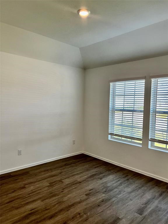 5304 Winding Strm Drive Rosenberg, TX 77469 - Photo 15 of 17 an empty room with wooden floor and windows