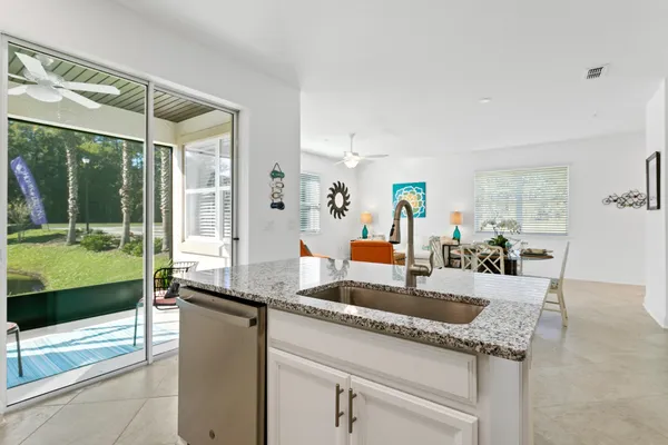 a kitchen with granite countertop a sink and a counter top space