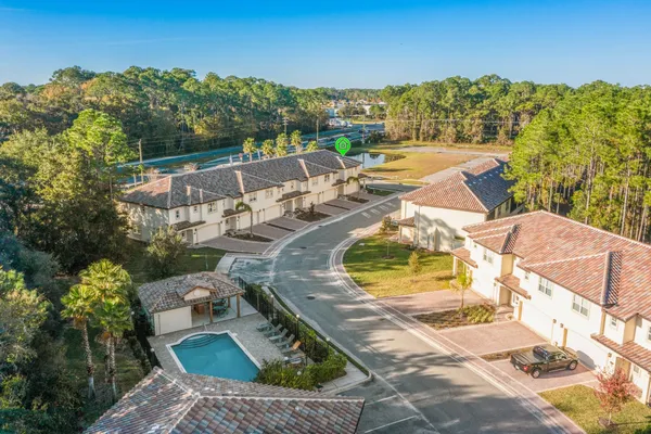 an aerial view of a house with outdoor space