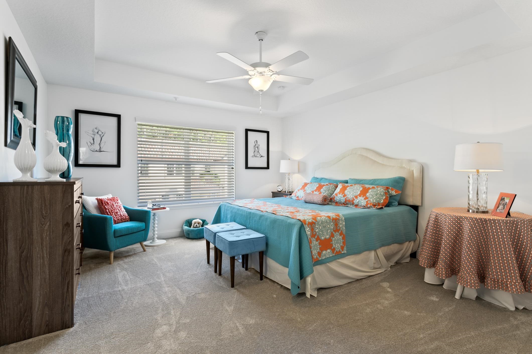 241 Grand Ravine Drive St. Augustine, FL 32086 - Photo 24 of 37 a bedroom with a bed and a couch