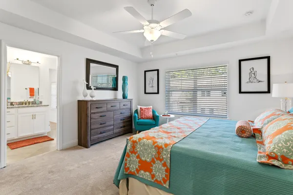 a bedroom with a bed and a cabinets