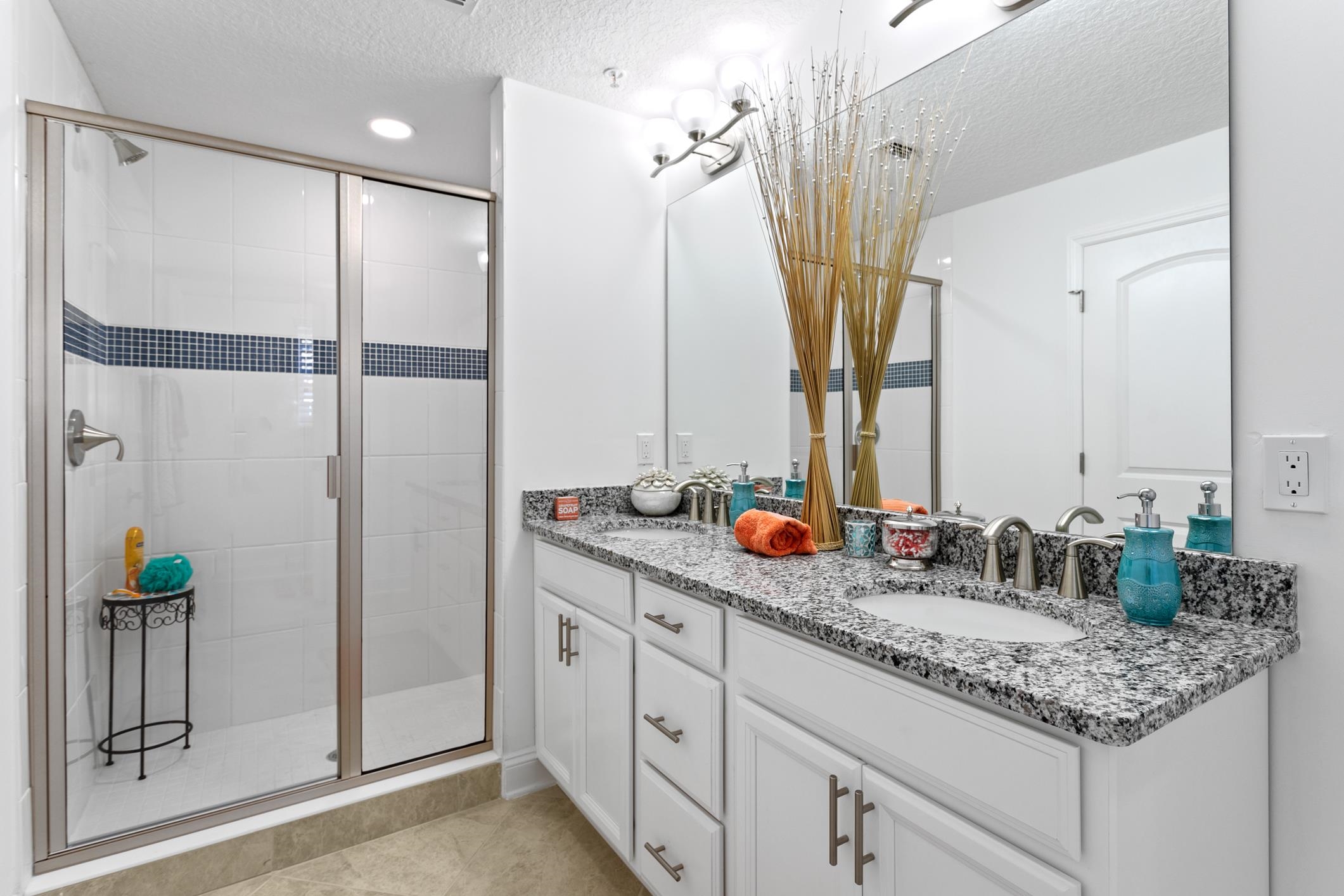 241 Grand Ravine Drive St. Augustine, FL 32086 - Photo 26 of 37 a bathroom with double vanity and a mirror