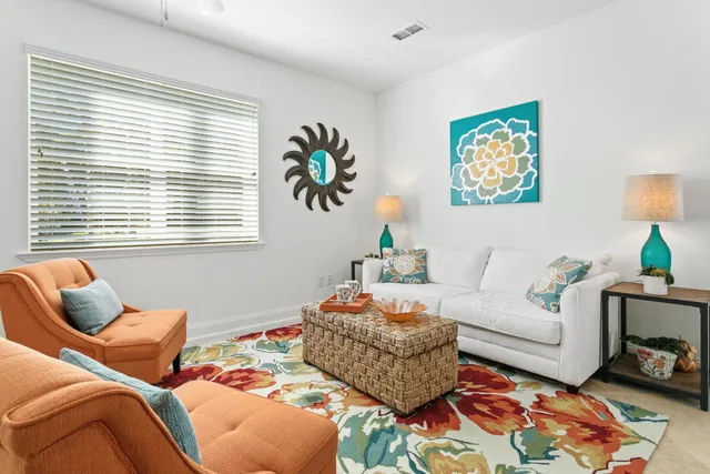 a living room with furniture and a window