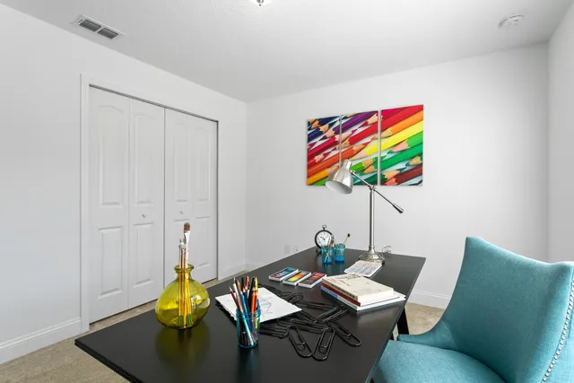 a view of a workspace with furniture