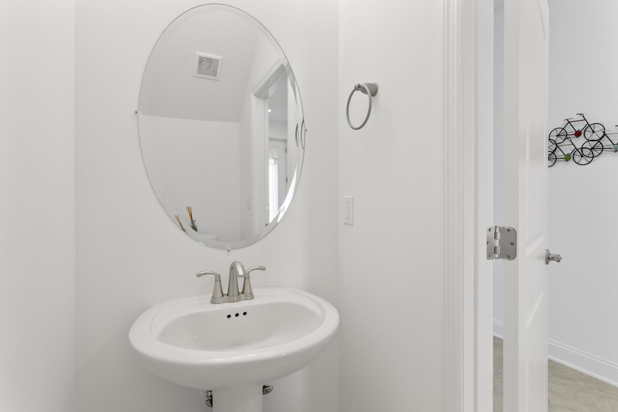 241 Grand Ravine Drive St. Augustine, FL 32086 - Photo 9 of 37 a bathroom with a sink and mirror