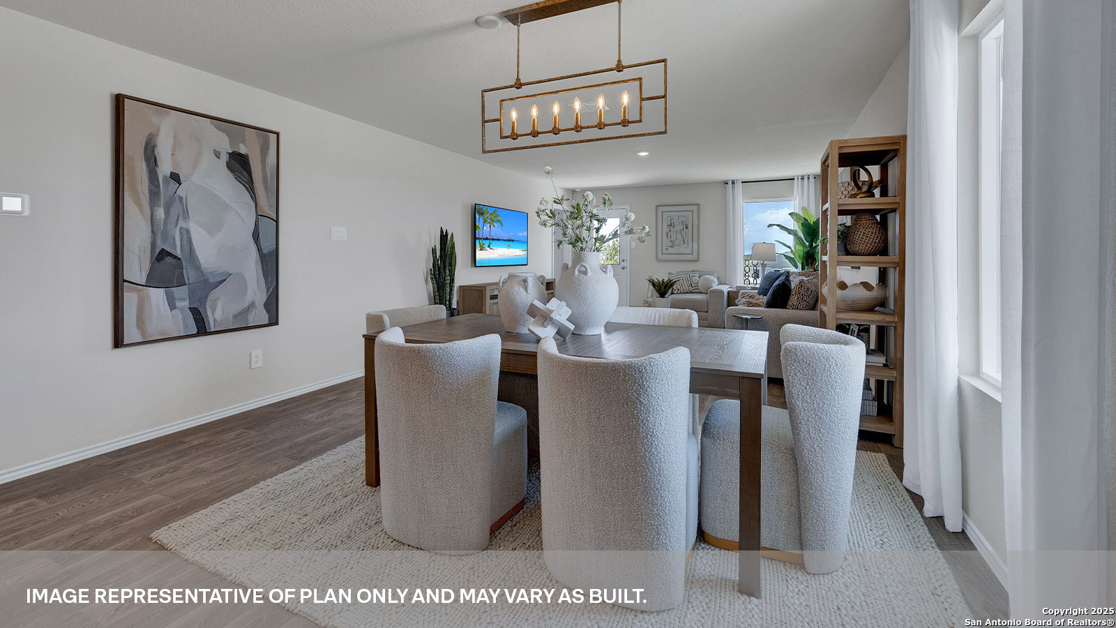 371 Low Pasture Trail Maxwell, TX 78656 - Photo 18 of 41 a view of a dining room with furniture wooden floor and a chandelier