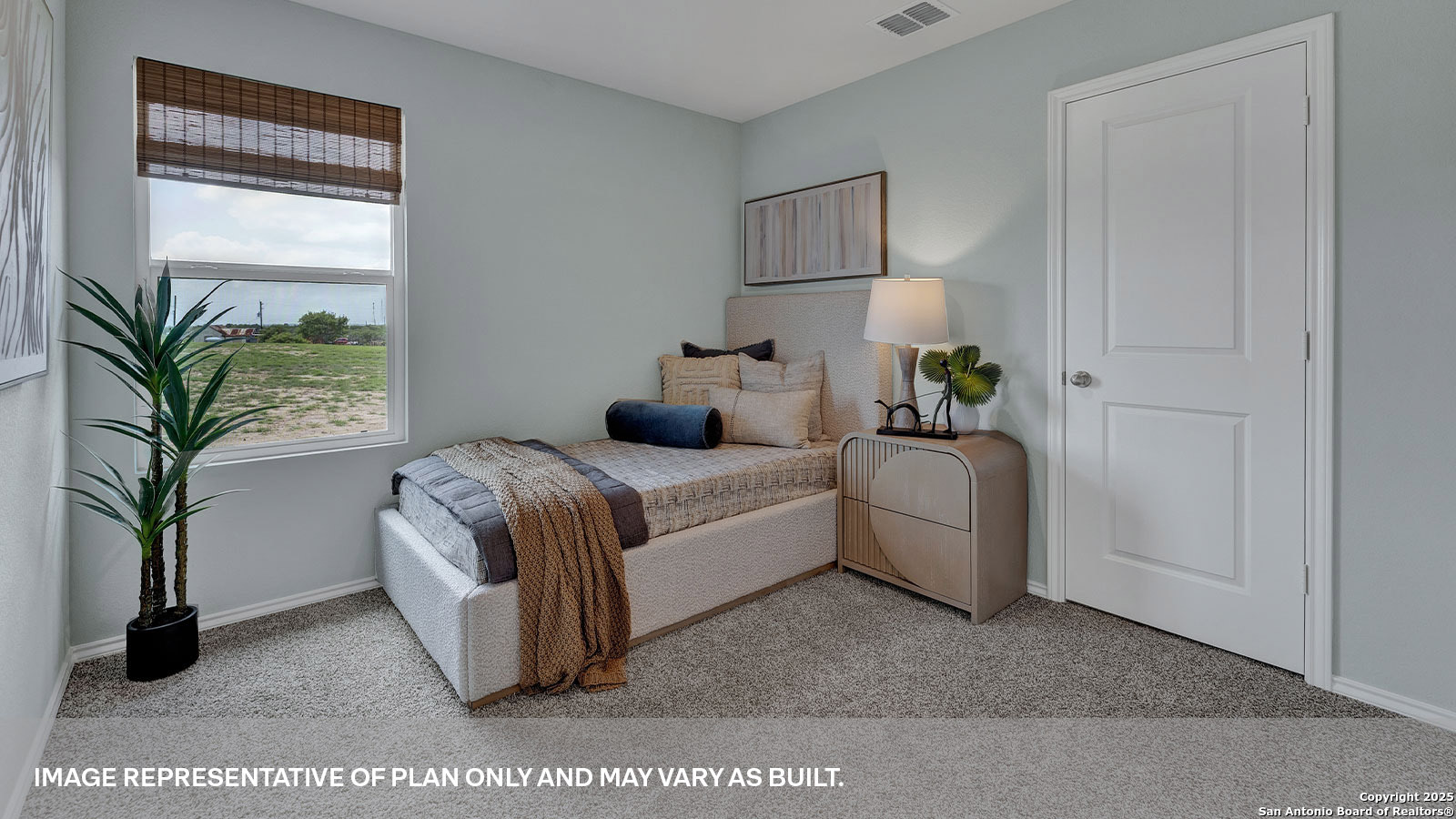 371 Low Pasture Trail Maxwell, TX 78656 - Photo 9 of 41 a bedroom with a bed and a potted plant