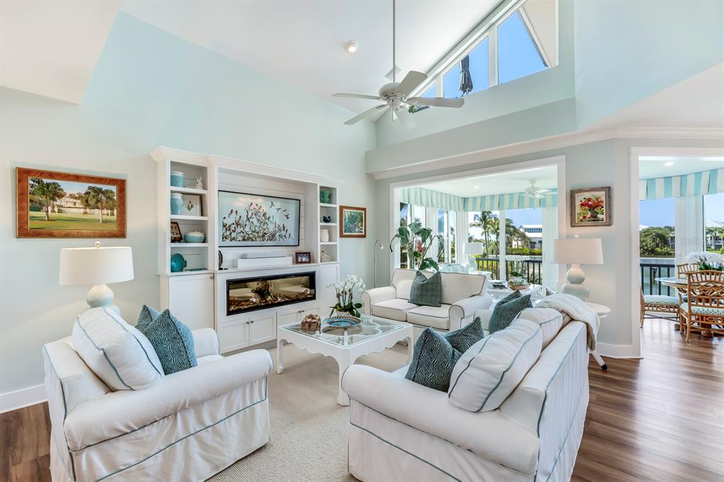 820 South Harbor Drive Boca Grande, FL 33921 - Photo 3 of 37 a living room with furniture a flat screen tv and a fireplace