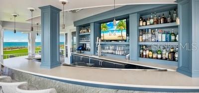 820 South Harbor Drive Boca Grande, FL 33921 - Photo 32 of 37 a living room with furniture and a flat screen tv