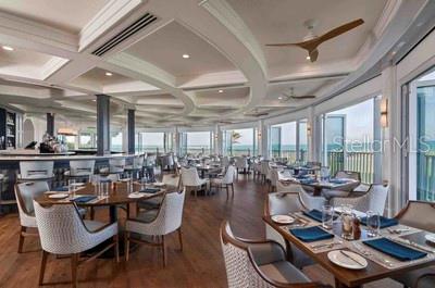 820 South Harbor Drive Boca Grande, FL 33921 - Photo 33 of 37 a room with lots of tables a large window and chairs