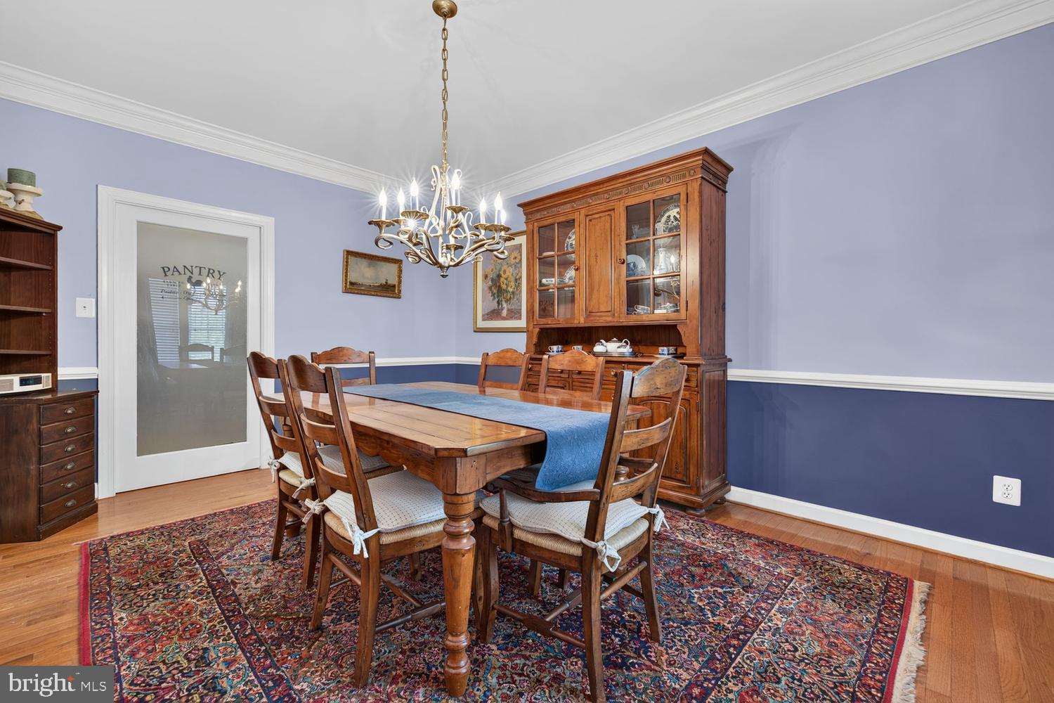 23106 Birch Mead Road Clarksburg, MD 20871 - Photo 11 of 60 a dining room with furniture chandelier and wooden floor