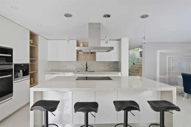 a kitchen with stainless steel appliances a sink and cabinets