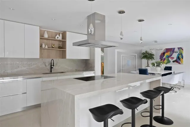 a kitchen with stainless steel appliances a sink and a stove