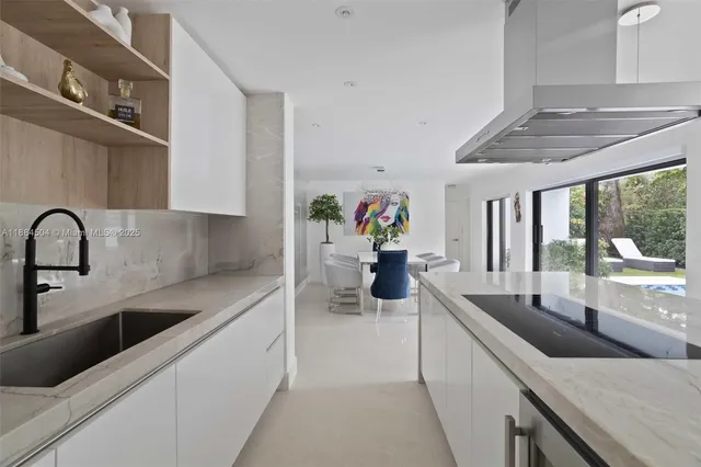 a kitchen with stainless steel appliances sink and cabinets