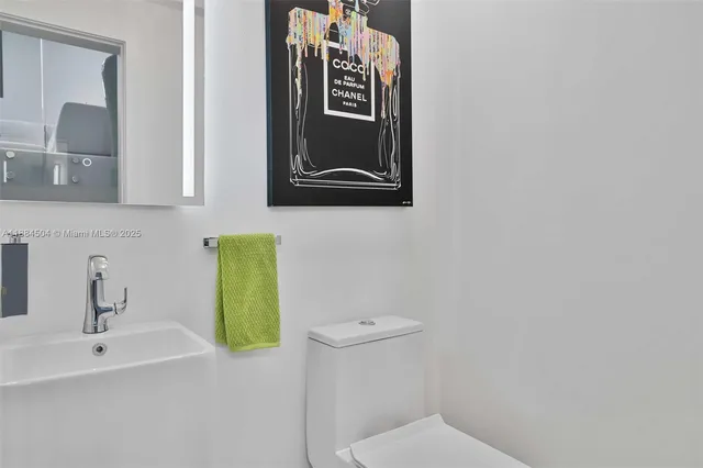 a bathroom with a toilet and a sink