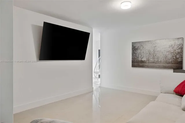 a living room with a flat screen tv
