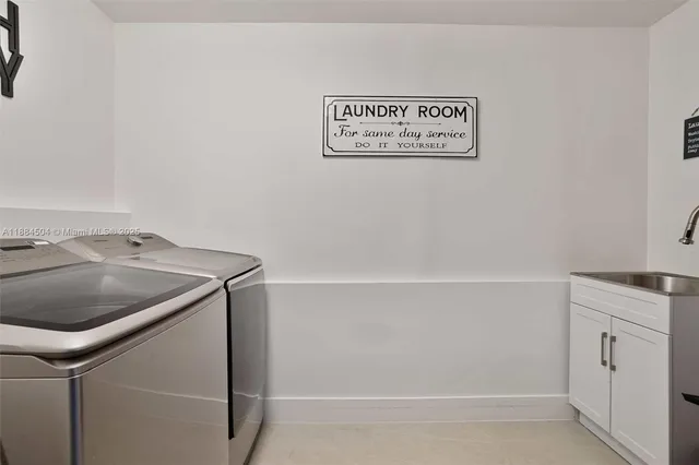 a view of a utility room with washer and dryer
