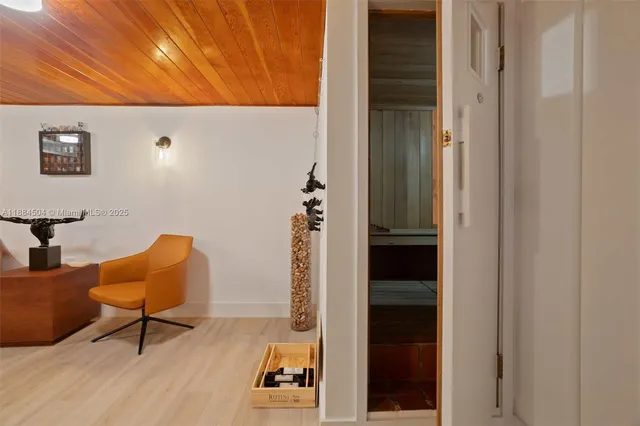 a view of a livingroom with furniture and an entryway