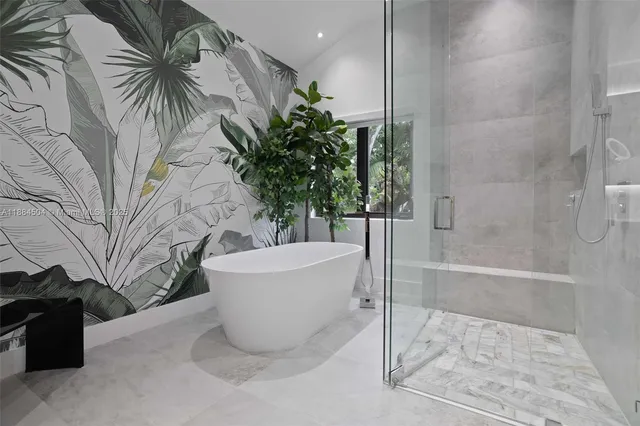 a white bath tub sitting in a bathroom