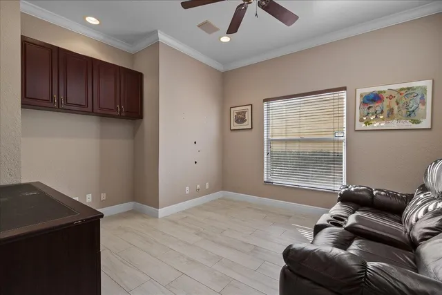 a living room with furniture fireplace and wooden floor