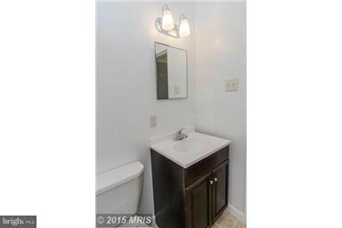 2978 Cornwall Road Dundalk, MD 21222 - Photo 13 of 27 a bathroom with a sink and a mirror