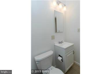 2978 Cornwall Road Dundalk, MD 21222 - Photo 27 of 27 a bathroom with a sink a toilet and mirror
