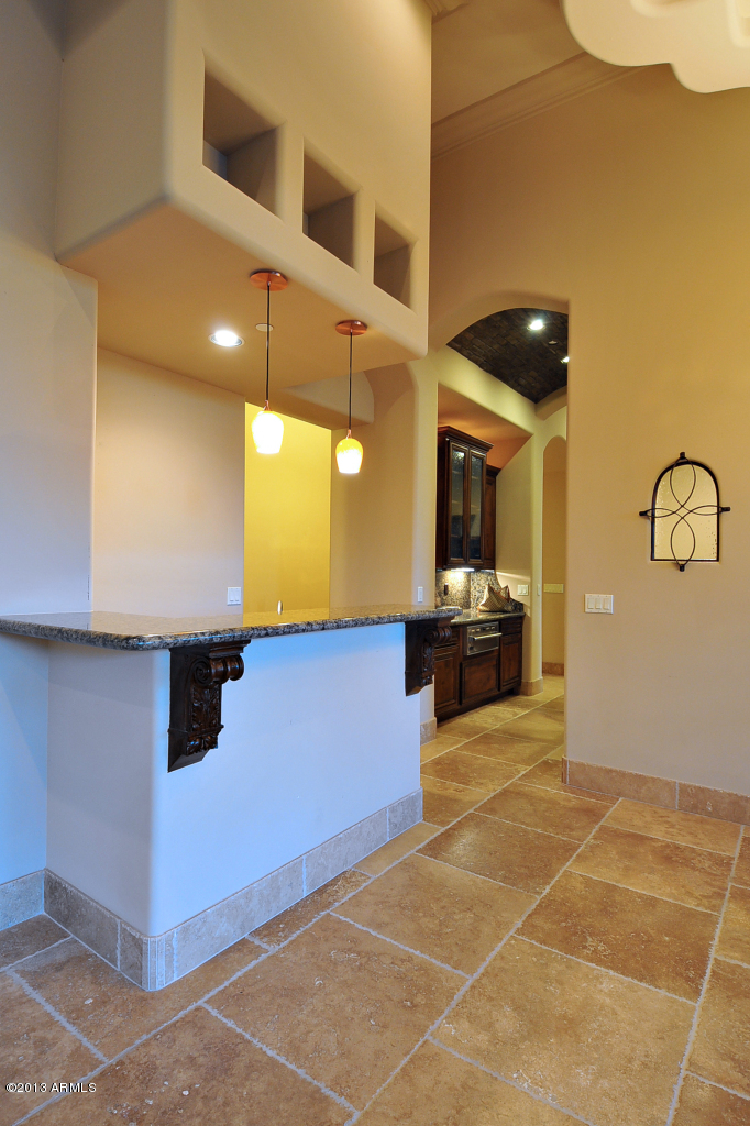 12827 East Cibola Road Scottsdale, AZ 85259 - Photo 14 of 64 a kitchen with stainless steel appliances a sink and a microwave